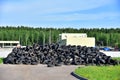 Industrial landfill for the processing of waste tires and rubber tyres. Pile of old tires and wheels for rubber recycling. Tyre