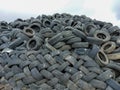 Industrial landfill for the processing of waste tires and rubber tyres. Pile of old tires and wheels for rubber recycling. Tyre Royalty Free Stock Photo