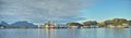 Industrial, landscape and factory by the ocean for manufacturing, plant or mill with boat outdoor. Panoramic view Royalty Free Stock Photo