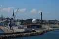 Industrial landscape. Port of Tallinn. In the background of the church, in the foreground - a crane, hangar and balloon