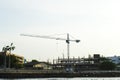 Industrial landscape with silhouettes of cranes on the sunset ba Royalty Free Stock Photo