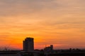 Industrial landscape with silhouettes of cranes Royalty Free Stock Photo