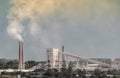 Industrial landscape smoke from the chimney of the plant and smog in the sky over the city in Ukraine Donbass Royalty Free Stock Photo