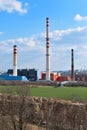 Industrial landscape. Thermal power plant with smoking from high chimneys. Ecological danger. Pile of waste