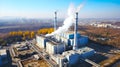 Industrial landscape, with Traditional thermal power plant generating heat, producing steam and smog. Environmental concept Royalty Free Stock Photo