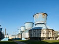 Industrial landscape with view of several ball gasholders with lightning protection and safety valve on modern chemical production