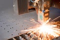 Industrial laser making holes in metal sheet Royalty Free Stock Photo