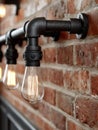 Industrial light fixture with Edison bulbs on brick wall Royalty Free Stock Photo