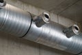 Stainless steel ventilation system in a loft room.