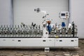 Industrial Machine with Rollers, Clamps and Control Panel â Factory Equipment Close-Up Royalty Free Stock Photo