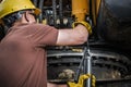 Industrial Machine Technician Pumping In the Grease Royalty Free Stock Photo