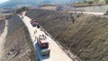 Industrial machinery at work. Aerial shot. Excavators and caterpillars on a landslide protection