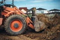 Industrial machinery at working construction site. Close up of backhoe loader working with engineer Royalty Free Stock Photo