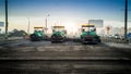 Industrial machines laying asphalt on new road