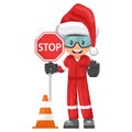 Industrial mechanic worker with Santa Claus hat holding stop sign with safety cone. Engineer with his personal protective