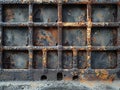 Industrial Metal Grid Stand Against a Raw Concrete Wall The cool metals blur into the urban toughness of the backdrop