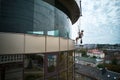 Industrial mountaineering worker cleaning window outside building. Royalty Free Stock Photo