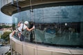 Industrial mountaineering worker cleaning window outside building. Royalty Free Stock Photo