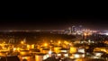 Industrial oil tanks in a refinery with building cityscape Royalty Free Stock Photo