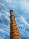 Industrial Old Brick Chimney on blue sky Royalty Free Stock Photo