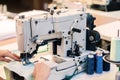 Industrial overlock sewing machine in work