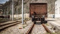 Industrial panorama view of the back of a brown vagon covered wi