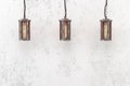 Industrial pendant lamp on a background of a rough wall