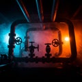 Industrial pipe setup with multiple valves, forming a rectangular frame. The Royalty Free Stock Photo