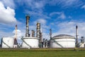 Industrial pipelines and silos at an oil refinery plant Royalty Free Stock Photo