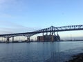 Industrial Plant Behind a Bridge over Hackensack River. Royalty Free Stock Photo