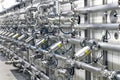 Industrial plant in a modern brewery - technology in a factory building with pipes and fittings Royalty Free Stock Photo
