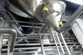 Industrial plant in a modern brewery - technology in a factory building with pipes and fittings Royalty Free Stock Photo