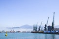 Industrial port blue water clear weather white fog on the backgroundyellow lighthouse landscape