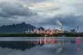 Industrial power plant with smokestack near the river Royalty Free Stock Photo