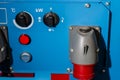 Industrial power supply control unit with temperature and kilowatt adjustment knobs, safety buttons and cable connectors for Royalty Free Stock Photo