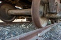 Industrial rail car wheels closeup photo. Old rusty train wheels. Wheel train system on track Royalty Free Stock Photo