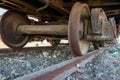 Industrial rail car wheels closeup photo. Old rusty train wheels. Wheel train system on track Royalty Free Stock Photo