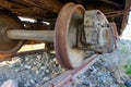 Industrial rail car wheels closeup photo. Old rusty train wheels. Wheel train system on track. Royalty Free Stock Photo