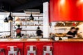 Industrial Red kitchen counter decorated in loft style including wood, white wall and red corrugated zinc sheet