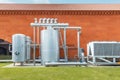 Industrial refrigeration system with compressor and metal tanks outside the wine production plant. Thermovinification Royalty Free Stock Photo