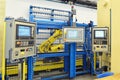 Industrial robot with control unit in a factory for mechanical e