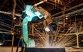 Industrial robot is welding in automotive part factory Royalty Free Stock Photo