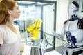 Industrial Robotic Engineer And Humanoid Robot Royalty Free Stock Photo