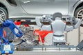 Industrial robotic teamwork working with auto parts for maintain car Royalty Free Stock Photo