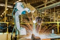 Industrial robots are welding assembly automotive part in car factory Royalty Free Stock Photo