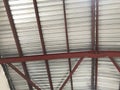 Industrial roofing top sheet over structural steel beam supports for and warehouse construction