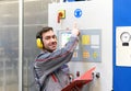 industrial safety: workers in an industrial plant with ear protection