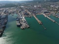 Industrial seaport, top view. Port cranes and cargo ships and barges. Royalty Free Stock Photo