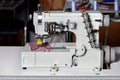 Industrial sewing machine for hemming and sewing clothes. Close-up Royalty Free Stock Photo