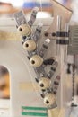 Industrial sewing machine thread tension regulators working Royalty Free Stock Photo